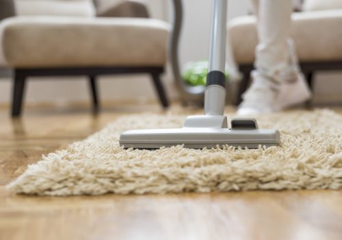 A closeup of a vacuum cleaner at a living room